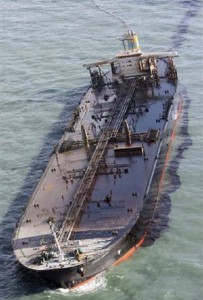 The Hebei Spirit leaking oil after being struck at anchor by a giant crane barge. 