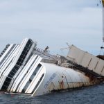 (FILES) This file picture taken on May 27, 2013 shows works in progress to remove the Costa Concordia cruise ship wreck on Giglio island. AFP PHOTO / FILES / VINCENZO PINTO        (Photo credit should read VINCENZO PINTO/AFP/Getty Images)